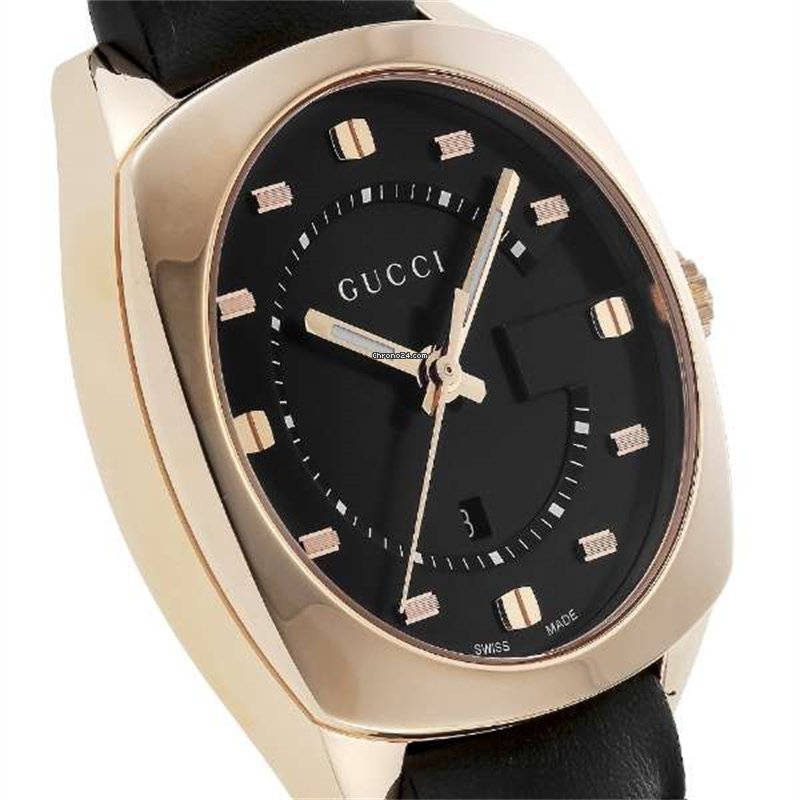 Close-up of Gucci GG2570 black dial with rose gold applied indices and hands