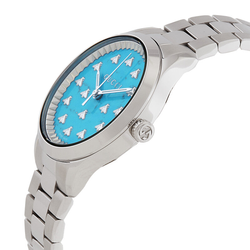 Side angle view of G-Timeless watch showing turquoise dial and stainless steel bracelet