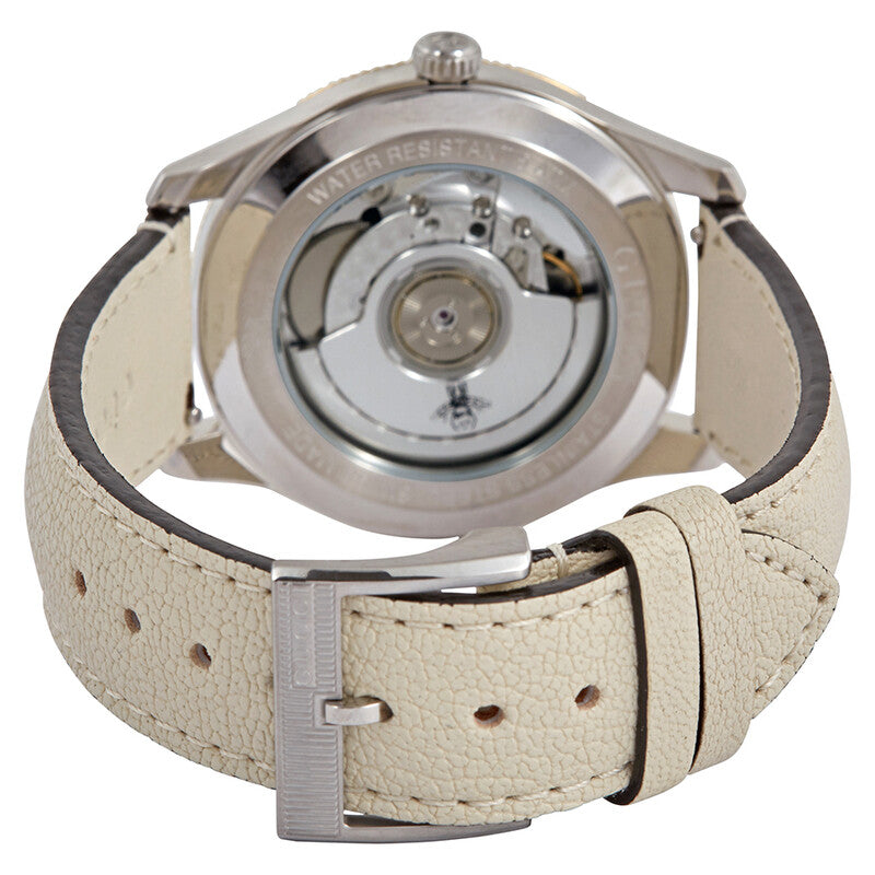 Gucci G-Timeless automatic movement visible through caseback with cream leather strap