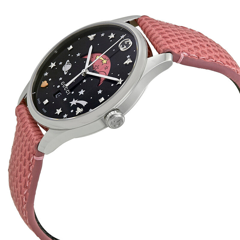 Gucci G-Timeless moon-phase watch on wrist, showing black dial with pink leather strap
