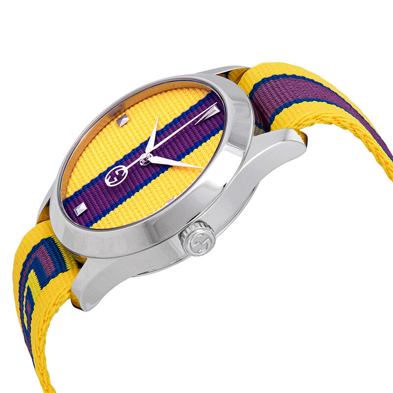 Angled view of Gucci G-Timeless watch with yellow dial, silver case, and yellow and purple striped strap