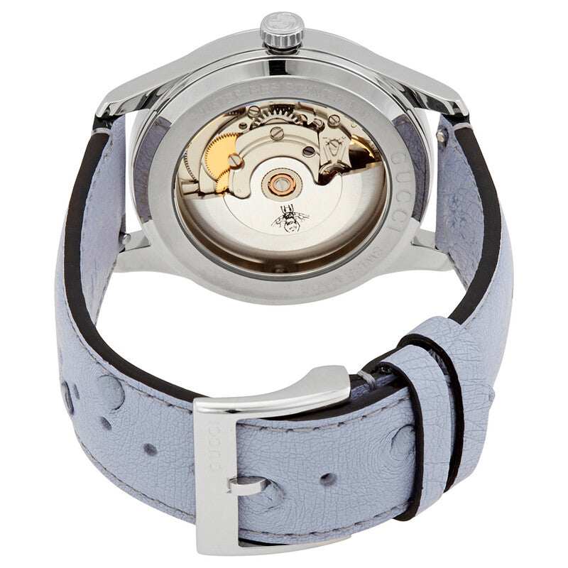 Gucci G-Timeless watch caseback showing automatic movement with gold rotor and visible mechanism