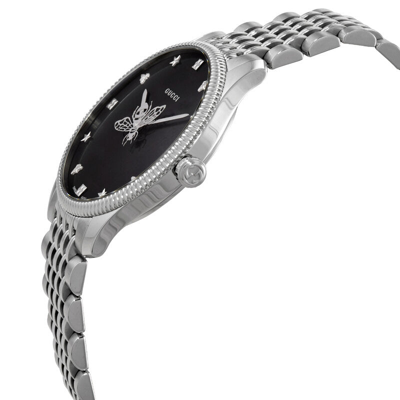 Gucci G-Timeless watch at angle showing stainless steel case, crystal bezel, and tapered bracelet