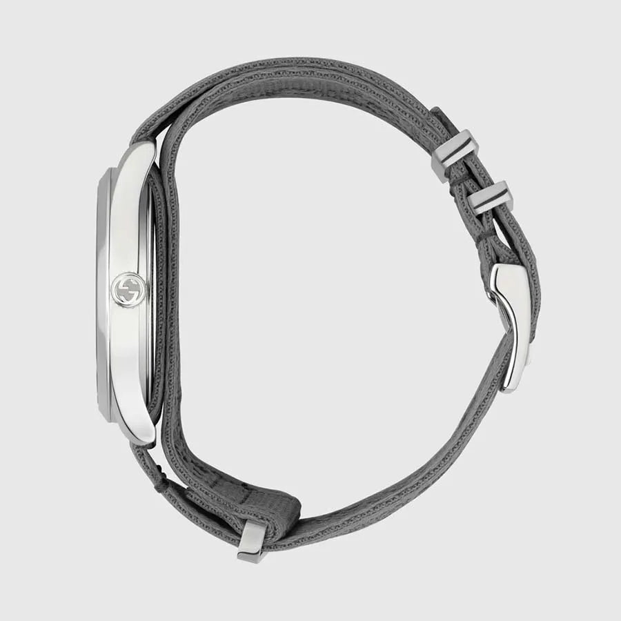 Gucci G-Timeless watch side profile with gray fabric strap and silver-tone case