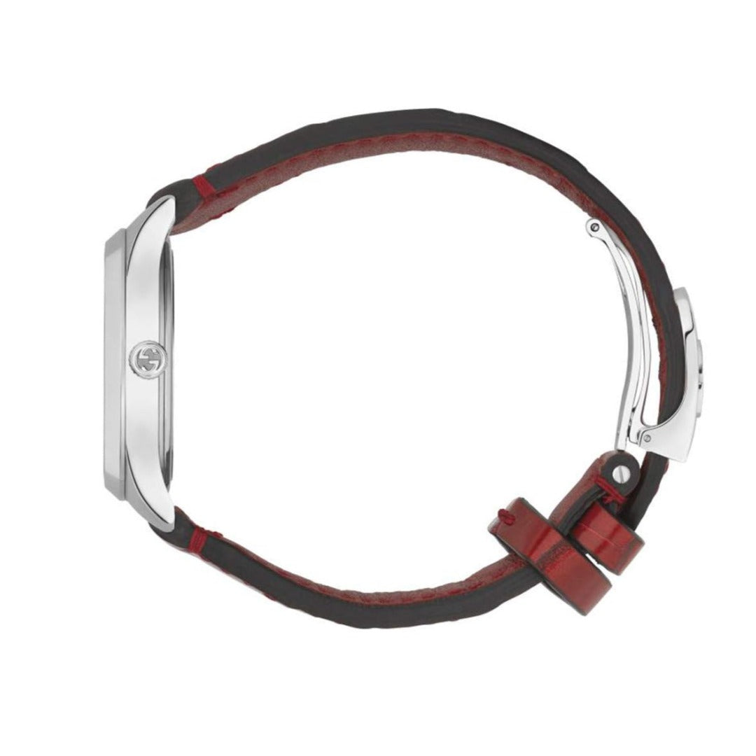 Gucci G-Timeless watch on wrist showing burgundy leather strap and white case