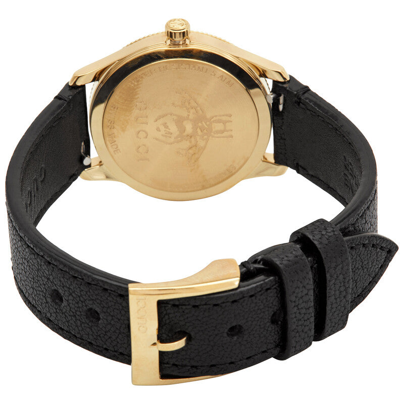 Gucci G-Timeless caseback showing gold-tone case with Gucci branding and black leather strap