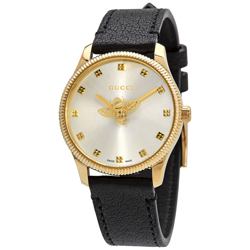 Gucci G-Timeless quartz watch with silver dial, gold case, and black leather strap