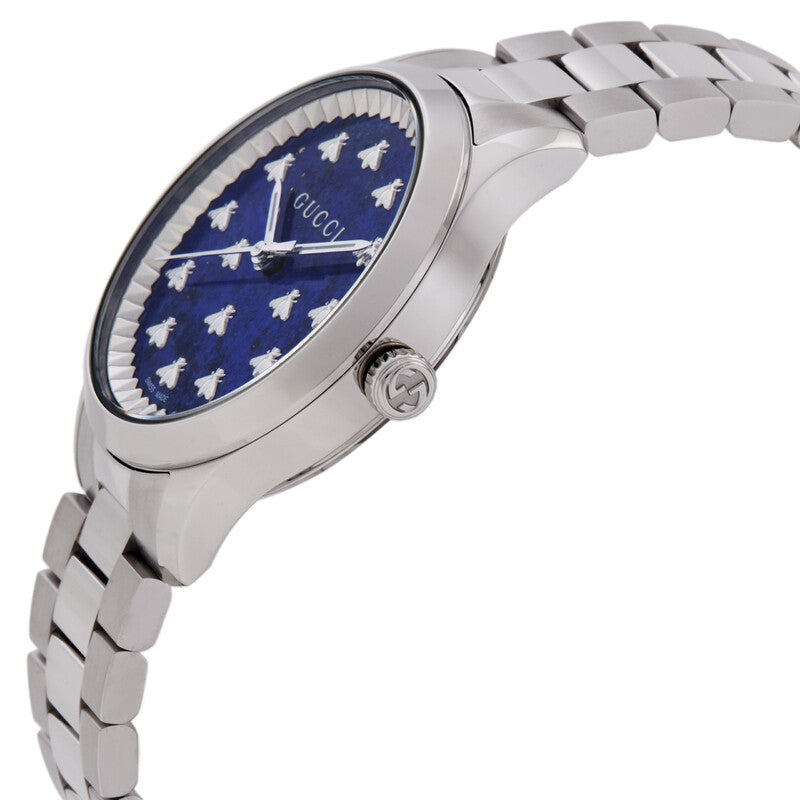 Side profile of Gucci G-Timeless watch with blue dial and silver steel bracelet