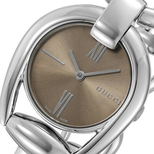 Close-up of Gucci Horsebit brown dial with Roman numerals and Gucci branding