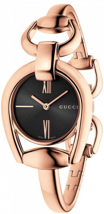 Gucci Horsebit rose gold women's watch with black dial and horsebit bracelet, worn on wrist
