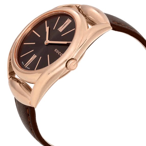 Side angle view of Gucci Horsebit watch showing rose gold case, brown dial, and brown leather strap