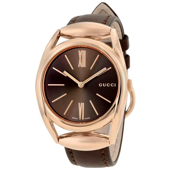 Gucci Horsebit 34mm women's watch with rose gold case and brown dial featuring Roman numeral markers