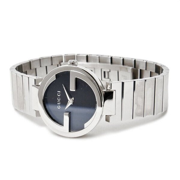 Gucci Interlocking G watch on wrist showing full stainless steel bracelet