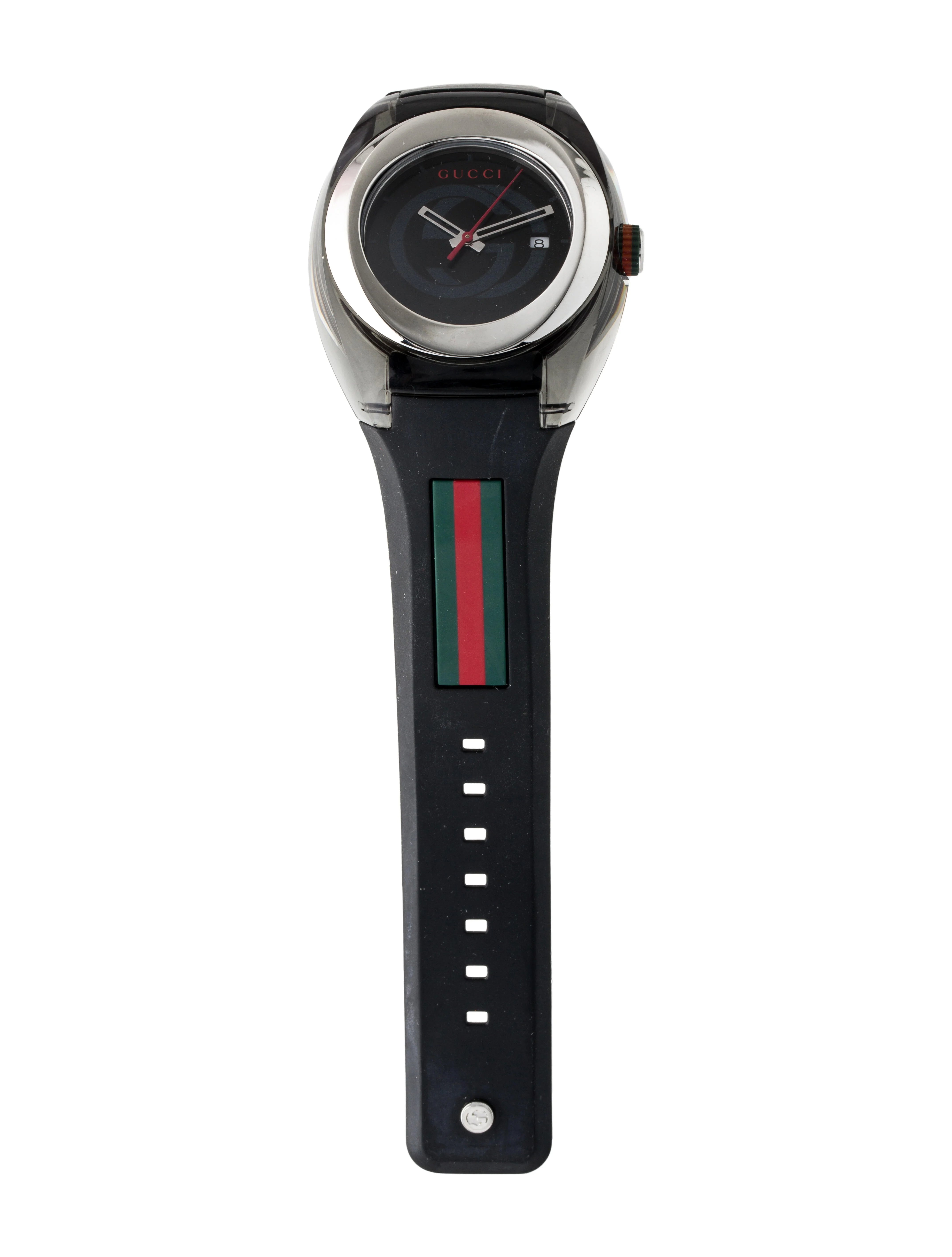 Gucci Sync watch worn on wrist, showing stainless steel case, dial detail, and web-striped black rubber strap