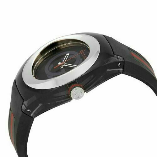 Gucci Sync watch side view showing stainless steel case profile, black rubber strap with red stripe, and crown detail