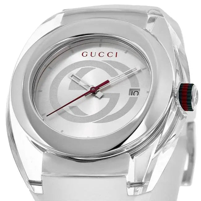 Angled view of Gucci Sync watch showing white dial, GG motif, and Gucci stripe strap detail