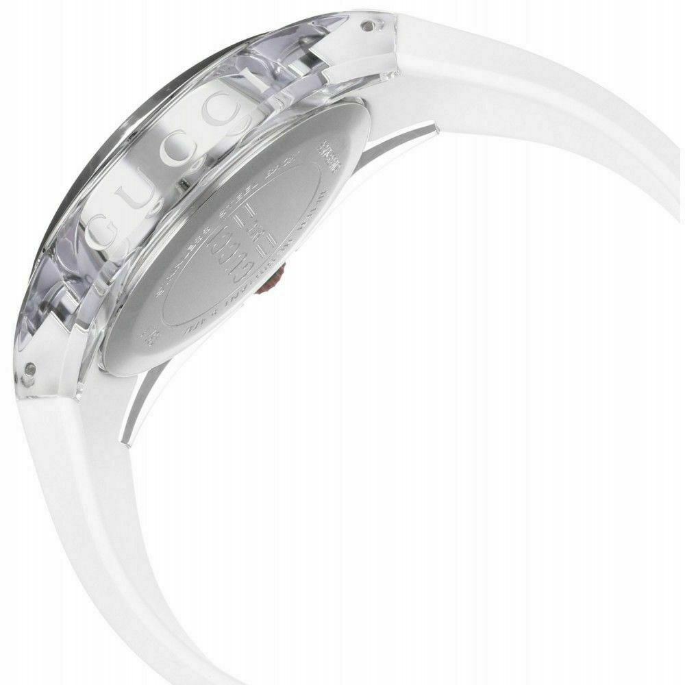Side profile of Gucci Sync watch displaying transparent case and white rubber strap