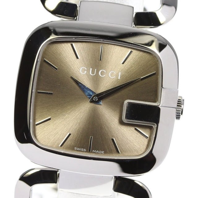 Gucci YA125401 dial detail with brushed brown face, silver markers, and Swiss Made text