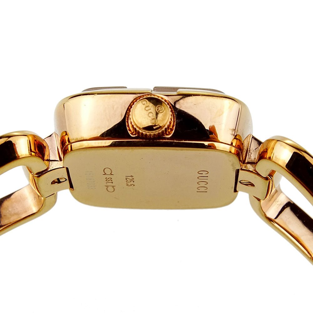 Gucci G rose gold ladies watch caseback showing engraved text and authentication details