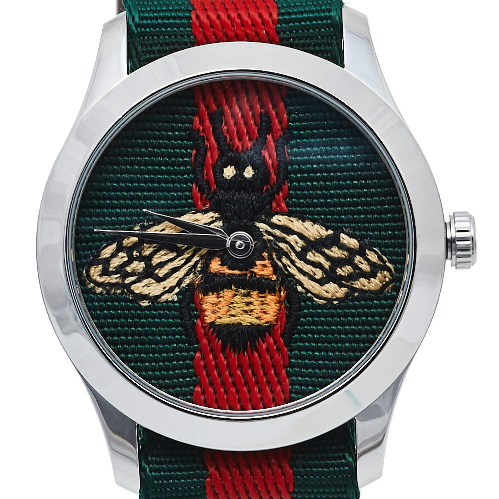 Close-up of GUCCI Le Marche des Merveilles dial with embroidered bee motif and gold-tone accents