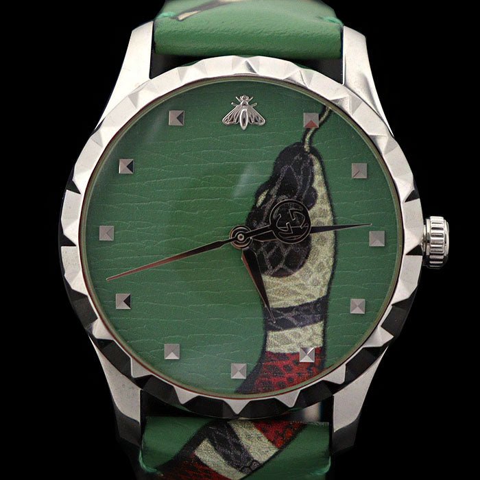 Close-up of Gucci Le Marche Des Merveilles dial showing kingsnake head and square markers