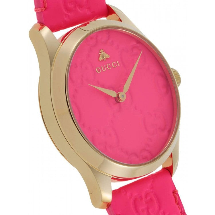 Gucci G Timeless watch at angle with pink leather strap and gold-tone bezel