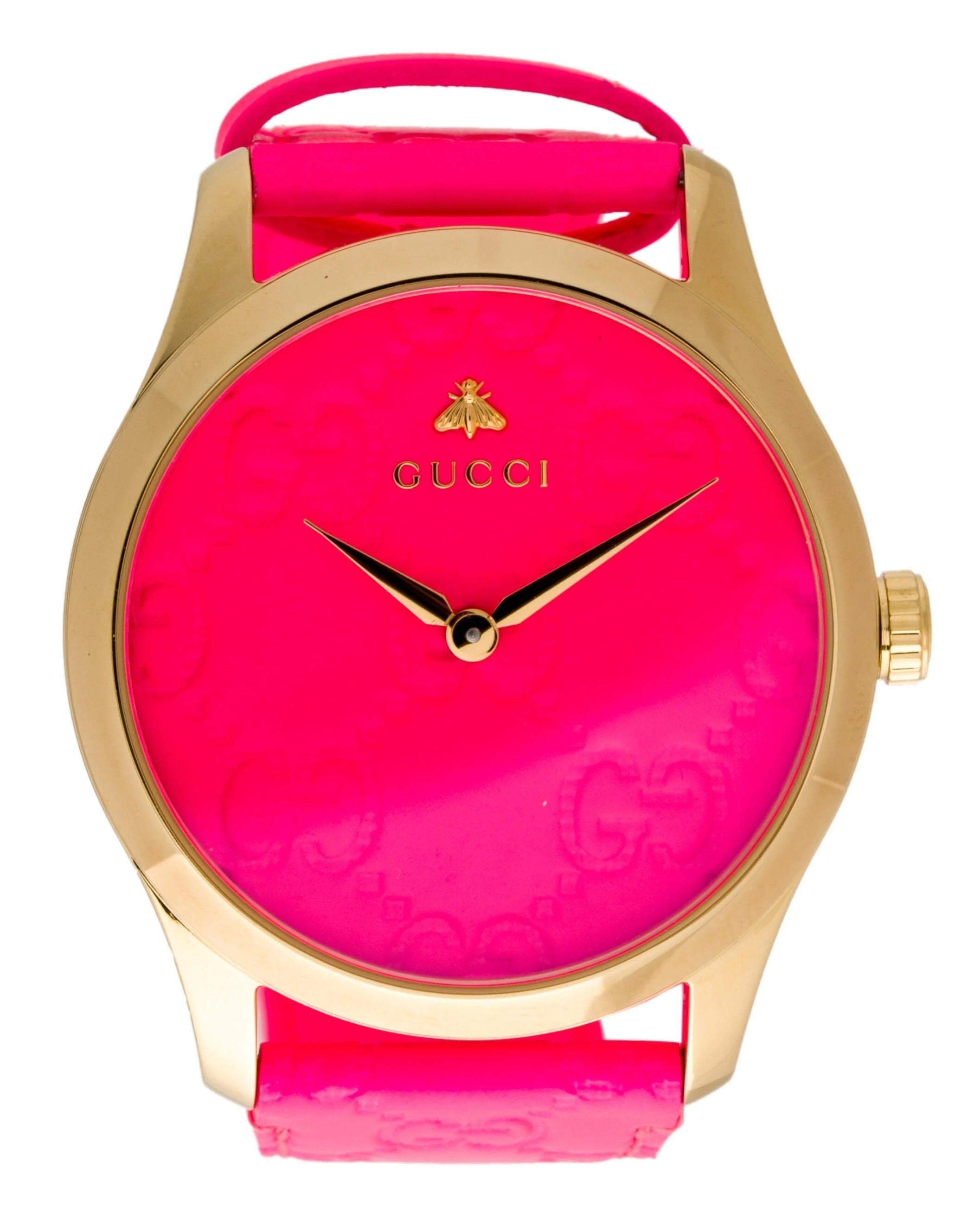 Close-up of Gucci G Timeless pink dial with GG embossing and gold-tone hands
