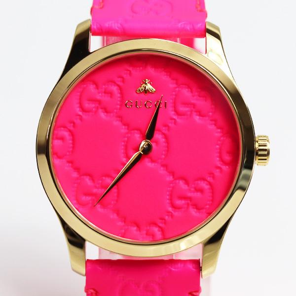 Gucci G Timeless watch front view with vibrant pink dial and gold case