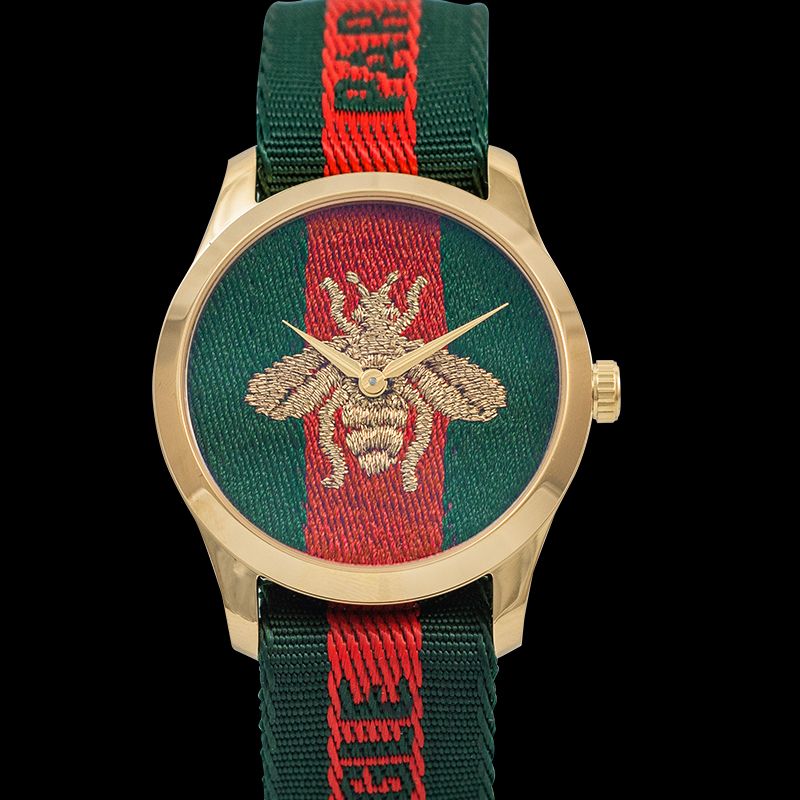 G-Timeless 38mm watch with embroidered bee on green and red dial, gold case, and fabric strap