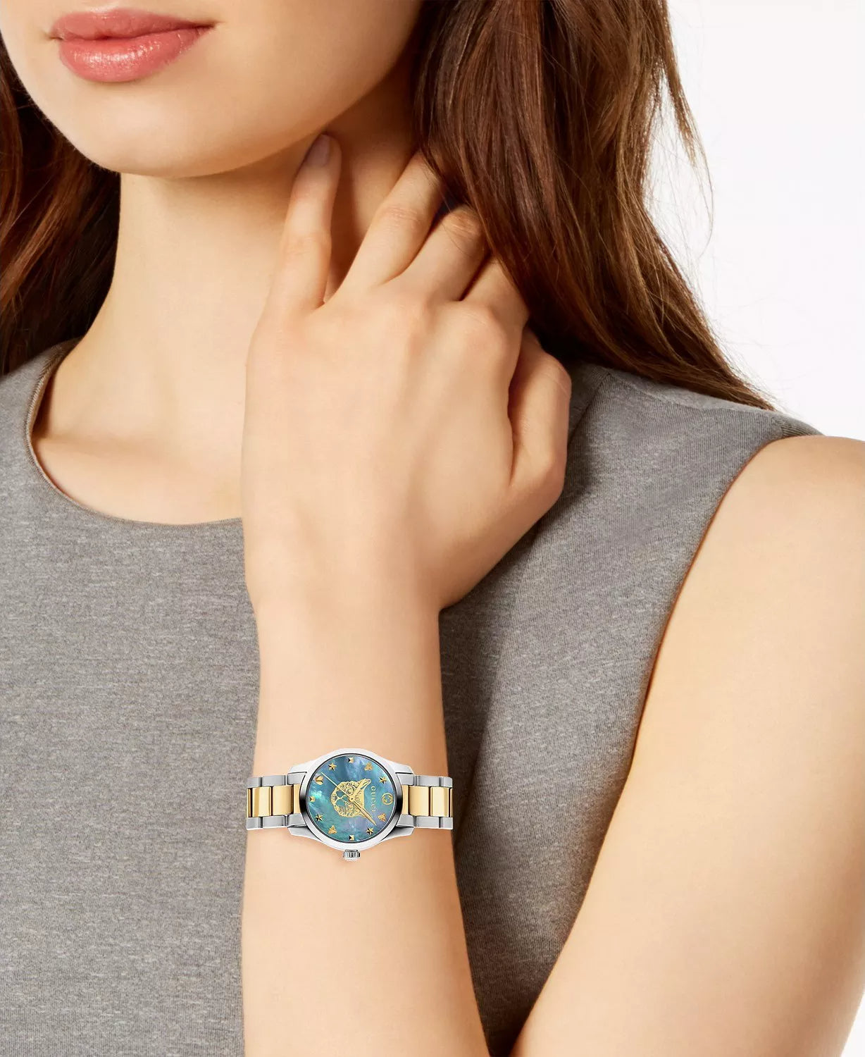 Gucci G-Timeless YA1265011 women's watch with blue dial worn on wrist