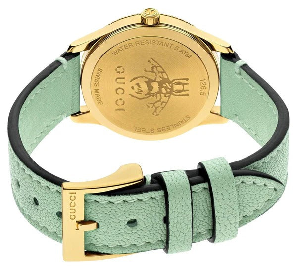 Gucci G-Timeless watch showing side profile of yellow gold PVD case with green leather strap
