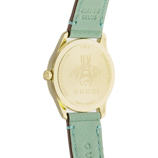 Gucci G-Timeless caseback showing yellow gold PVD case with bee logo and Swiss made marking