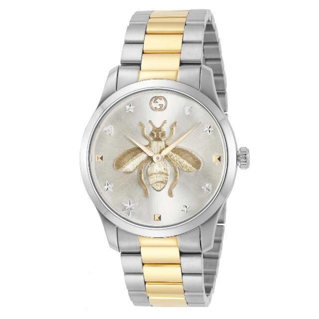 Three-quarter view of Gucci G-Timeless YA126599 watch showing two-tone bracelet and bee motif dial
