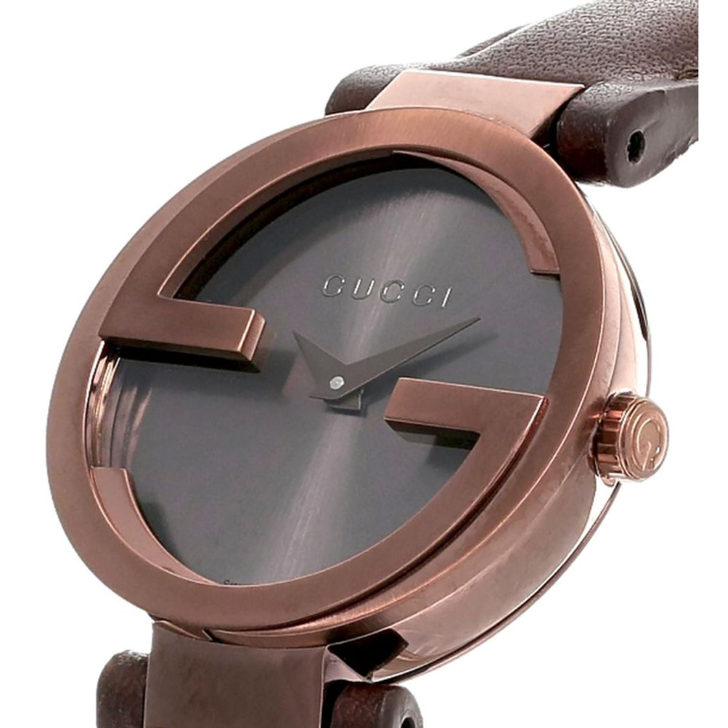 Close-up of Gucci Interlocking G dial with rose gold case and GG logo