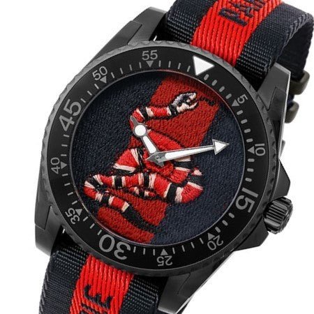GUCCI Dive 45MM watch at angle showing stainless steel case and nylon strap