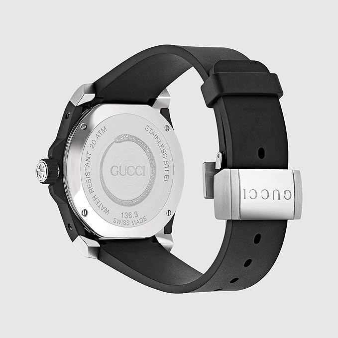 Gucci Dive watch caseback showing engraved Gucci logo and watch specifications on stainless steel