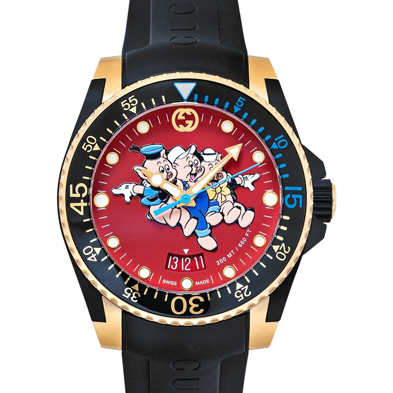 Gucci Dive watch front view with red dial, gold case, and character design