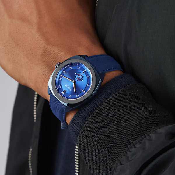 Gucci Interlocking watch worn on wrist with blue strap