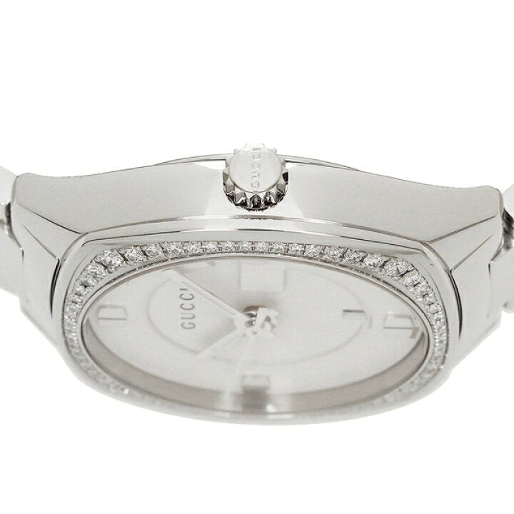 Gucci YA142506 watch top-down view showing diamond bezel and white dial