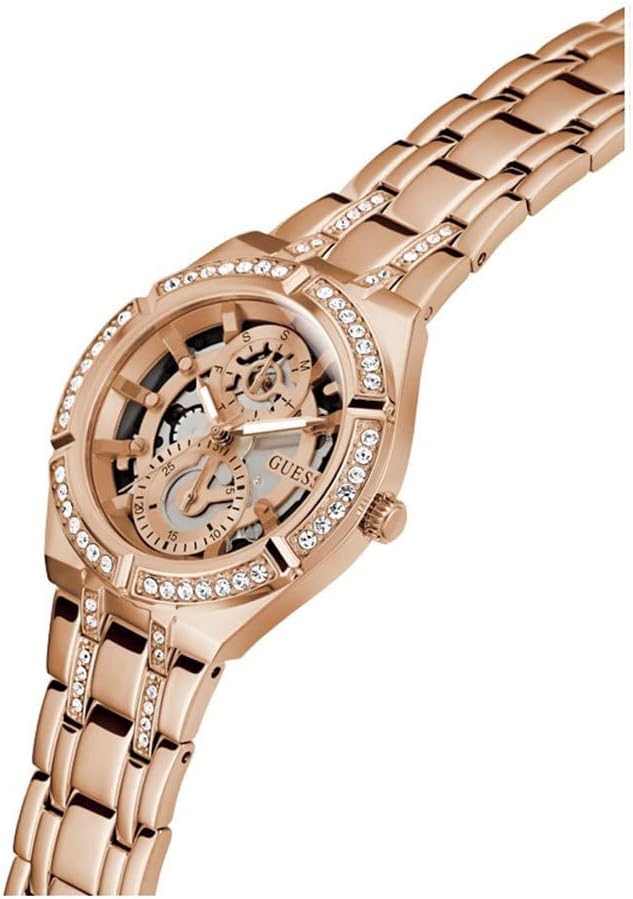 Angled view of Guess Allara rose gold watch with skeleton dial detail