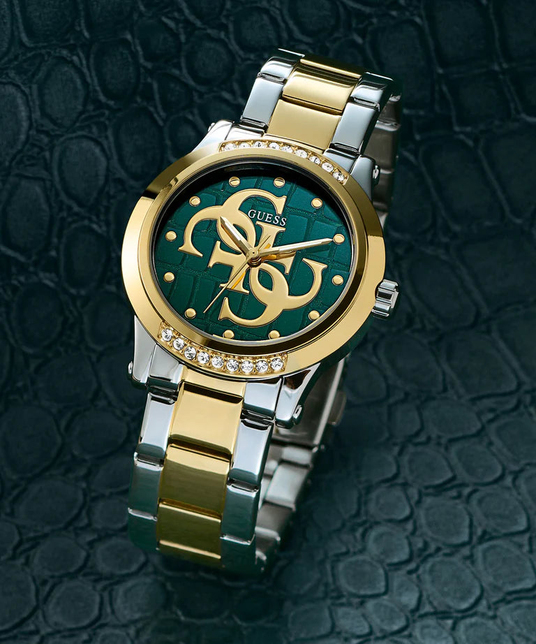 Guess Annette 36mm ladies watch with teal dial and two-tone metal bracelet on textured background