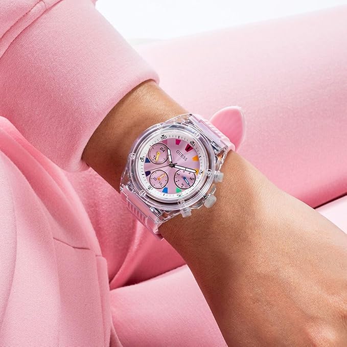 Guess Athena watch worn on wrist with pink dial and chronograph subdials visible