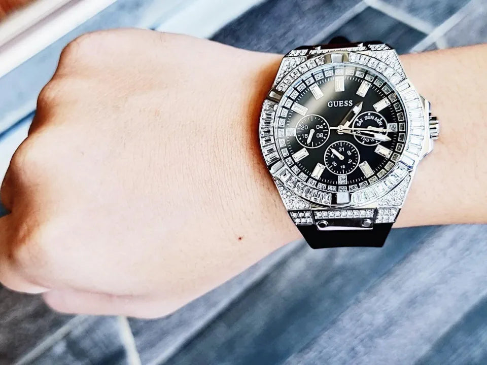 Guess Baguette Crystals watch on wrist showing crystal bezel and black dial with chronograph