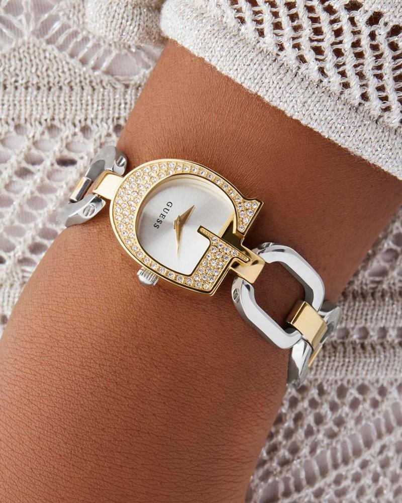 GUESS Bejeweled watch on wrist showing silver dial and two-tone steel and rose gold bracelet