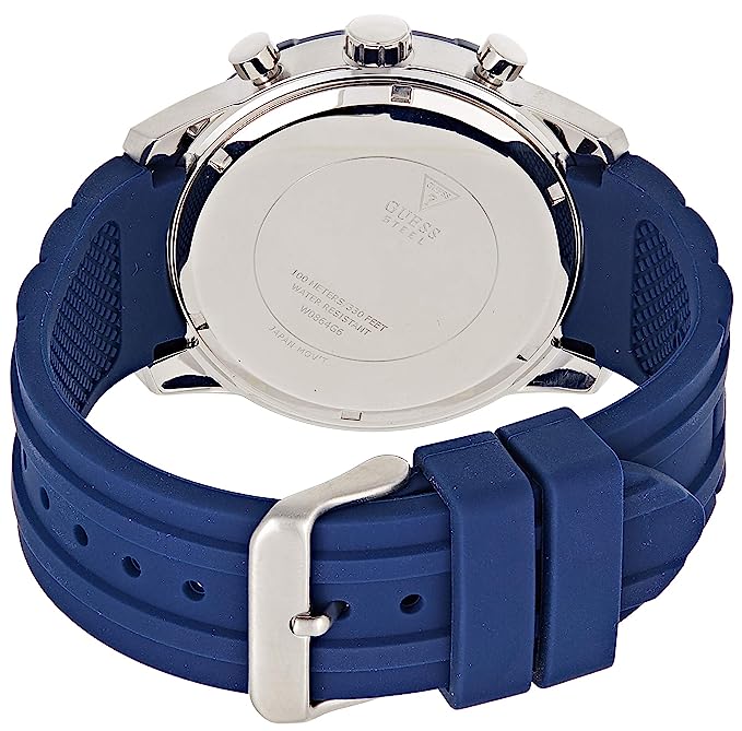 Caseback view of Guess Caliber watch showing blue rubber strap and silver-tone case