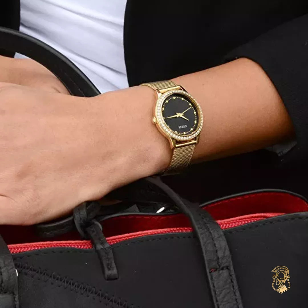 Guess Chelsea black dial gold mesh watch worn on wrist showing 30mm case size