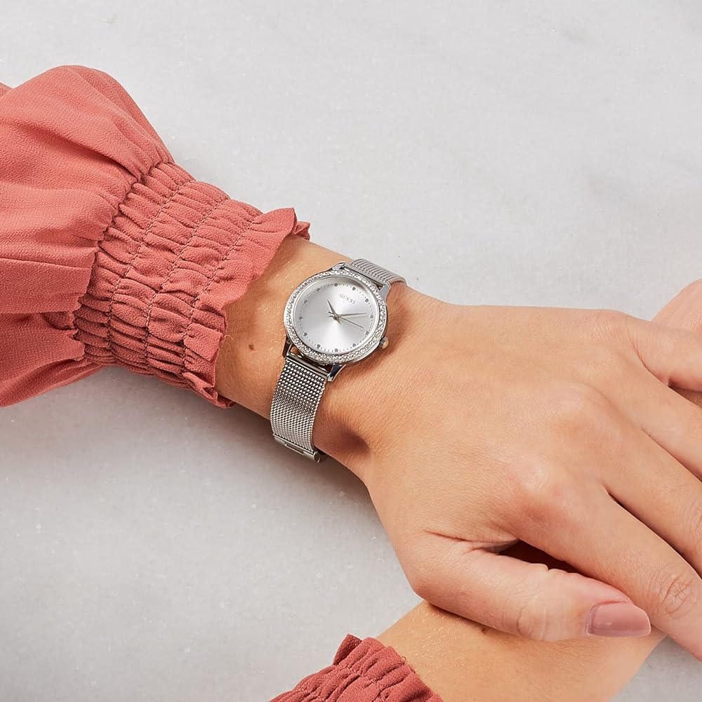 Guess Chelsea watch on wrist with silver mesh strap and crystal bezel