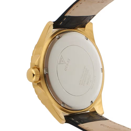 Watch caseback showing gold-tone case with engraved Guess branding