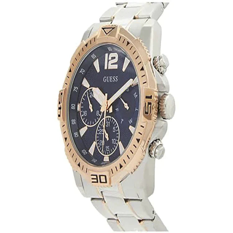 Guess Commander two-tone watch at angle showing blue chronograph dial and two-tone bracelet