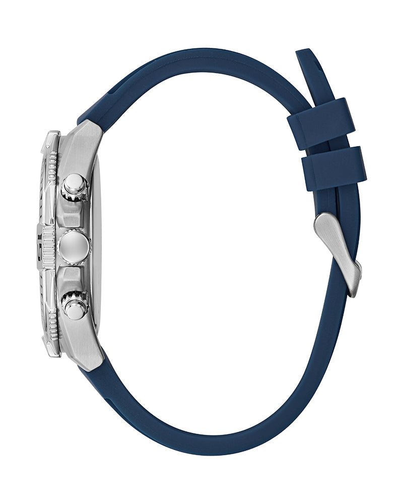 Side view of Guess Commander watch showing blue silicone strap and silver-tone case profile
